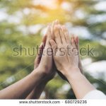 stock-photo-teamwork-concept-group-of-diversity-people-make-a-high-five-in-the-air-to-greeting-power-of-tag-680729236